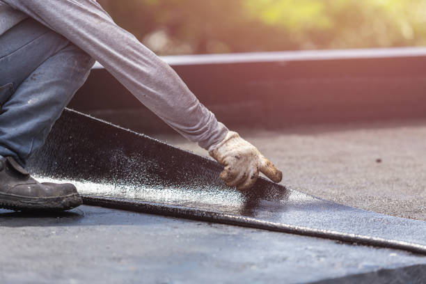 Professional Basement Waterproofing technician working in Rockville, MD